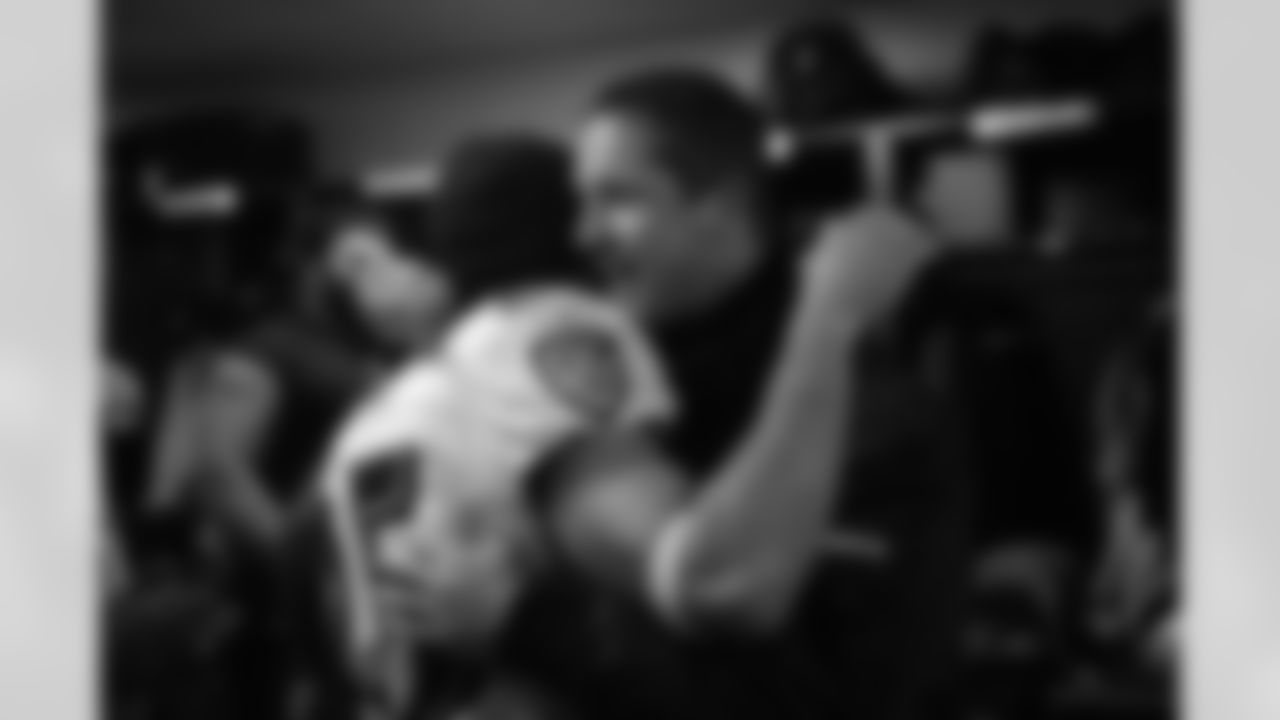 The Ravens celebrate their their historic 33-14 wild card win in New England. Head Coach John Harbaugh high-fived Ravens fans around the edge of the stadium before joining his team in the locker room.
