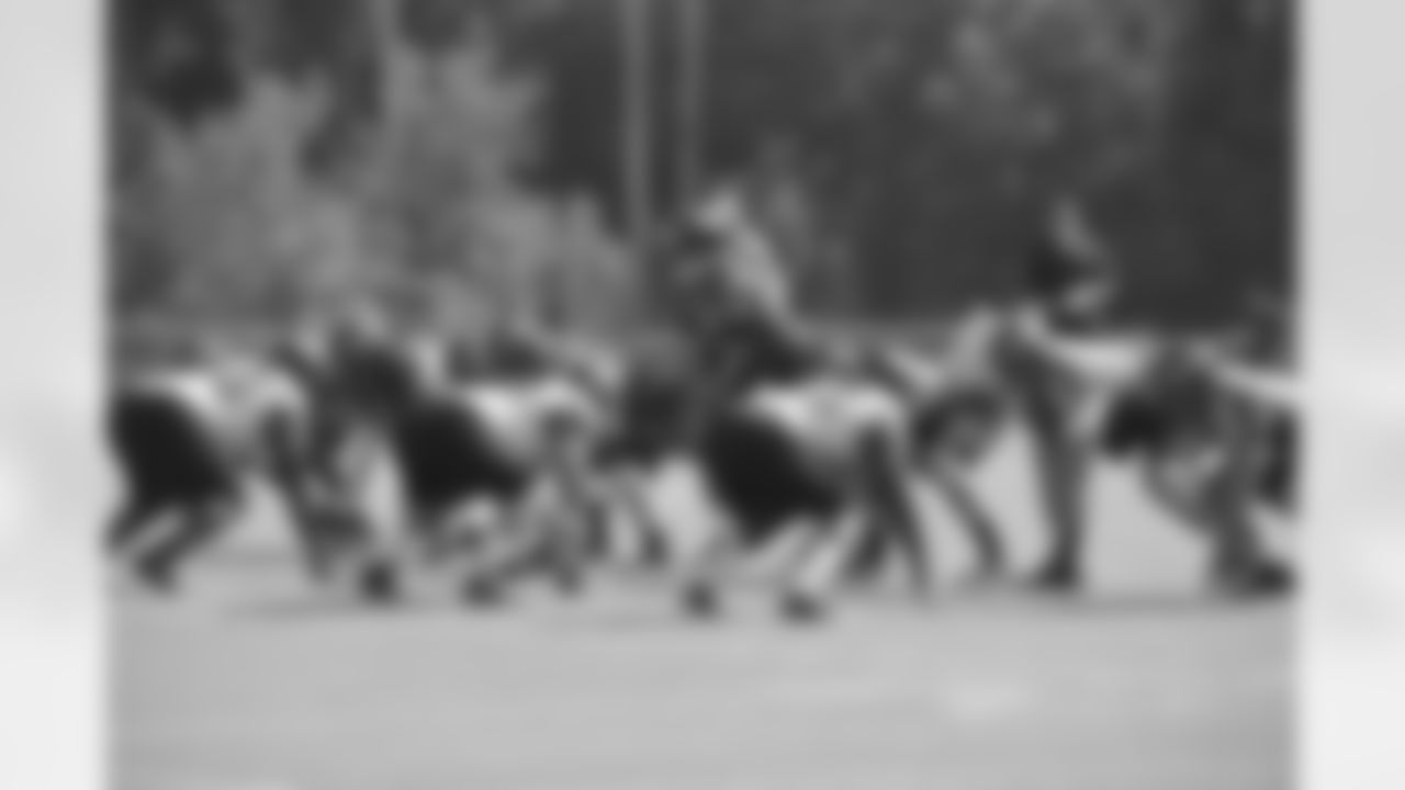 Joe Flacco leads a drill on the first day of training camp.