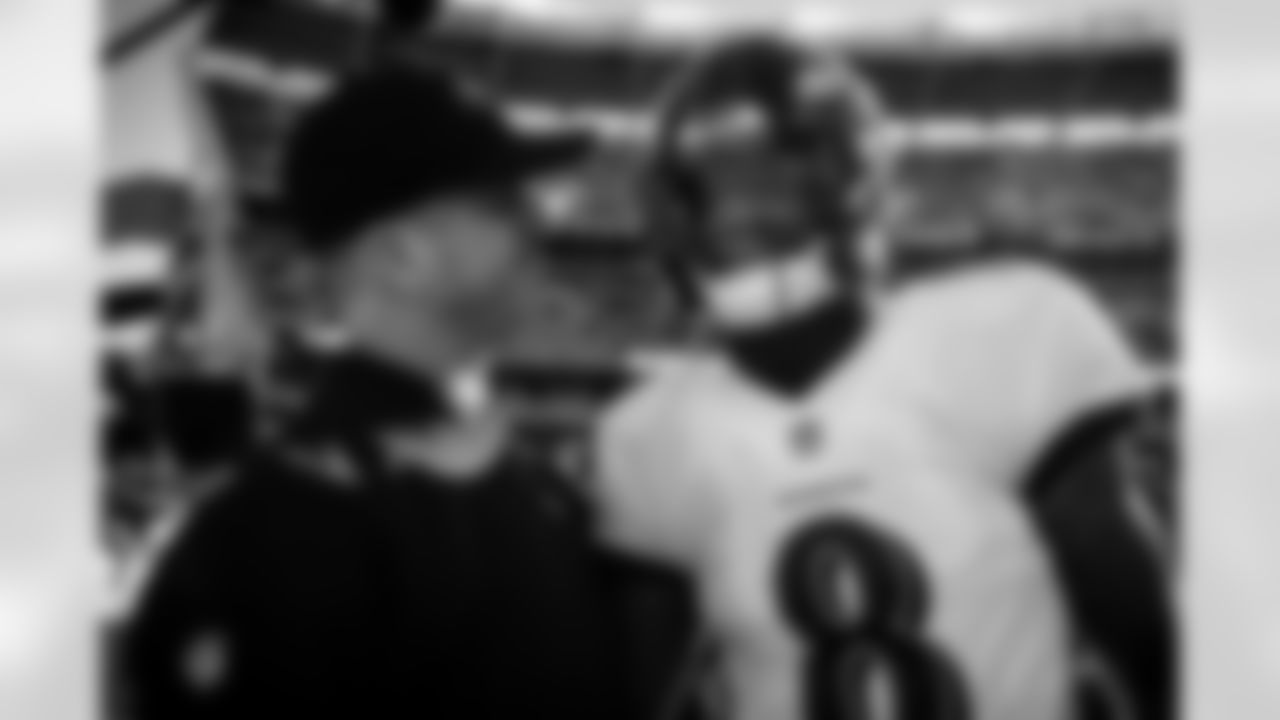 Head Coach John Harbaugh and QB Lamar Jackson