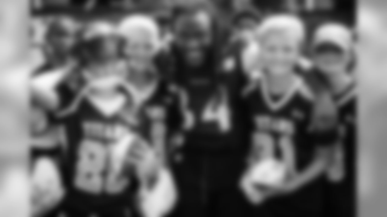 Youth Football Team Members with RB Alex Collins