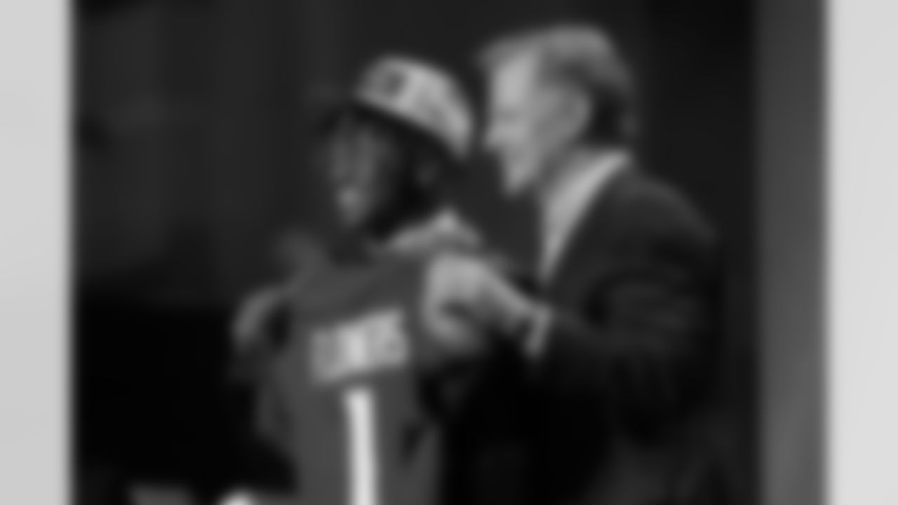 Boston College wide receiver Zay Flowers, left, and Roger Goodell, NFL Commissioner, hold a team jersey after Flowers was chosen by the Baltimore Ravens with the No. 22 pick at the 2023 NFL Draft, Thursday, April 27, 2023, in Kansas City, Mo. (AP Photo/Steve Luciano)