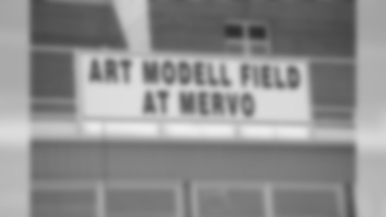 The Ravens All Community Team Foundation, Ravens owner Steve Bisciotti, CB Chris McAlister and the NFL Youth Football Fund gather at Mergenthaler Vocational Technical High School (Mervo) to dedicate the refurbished stadium in August 2008.