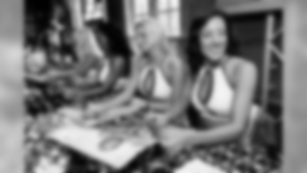The Baltimore Ravens Cheerleaders gather at High Topps Backstage Grille in Timonium, MD to autograph swimsuit calendars in 2008.