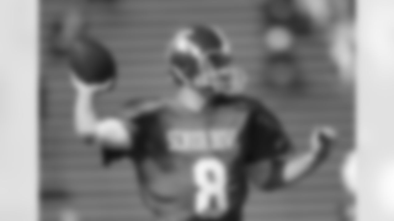 Michigan State's Kirk Cousins, a North squad quarterback, eyes a target downfield.