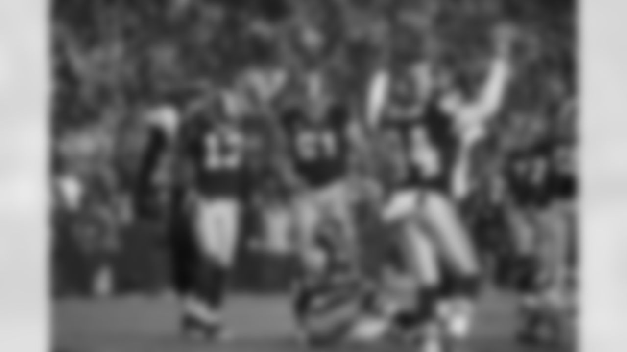 The Redskins offense celebrates after Keiland Williams scores. (Ned Dishman)
