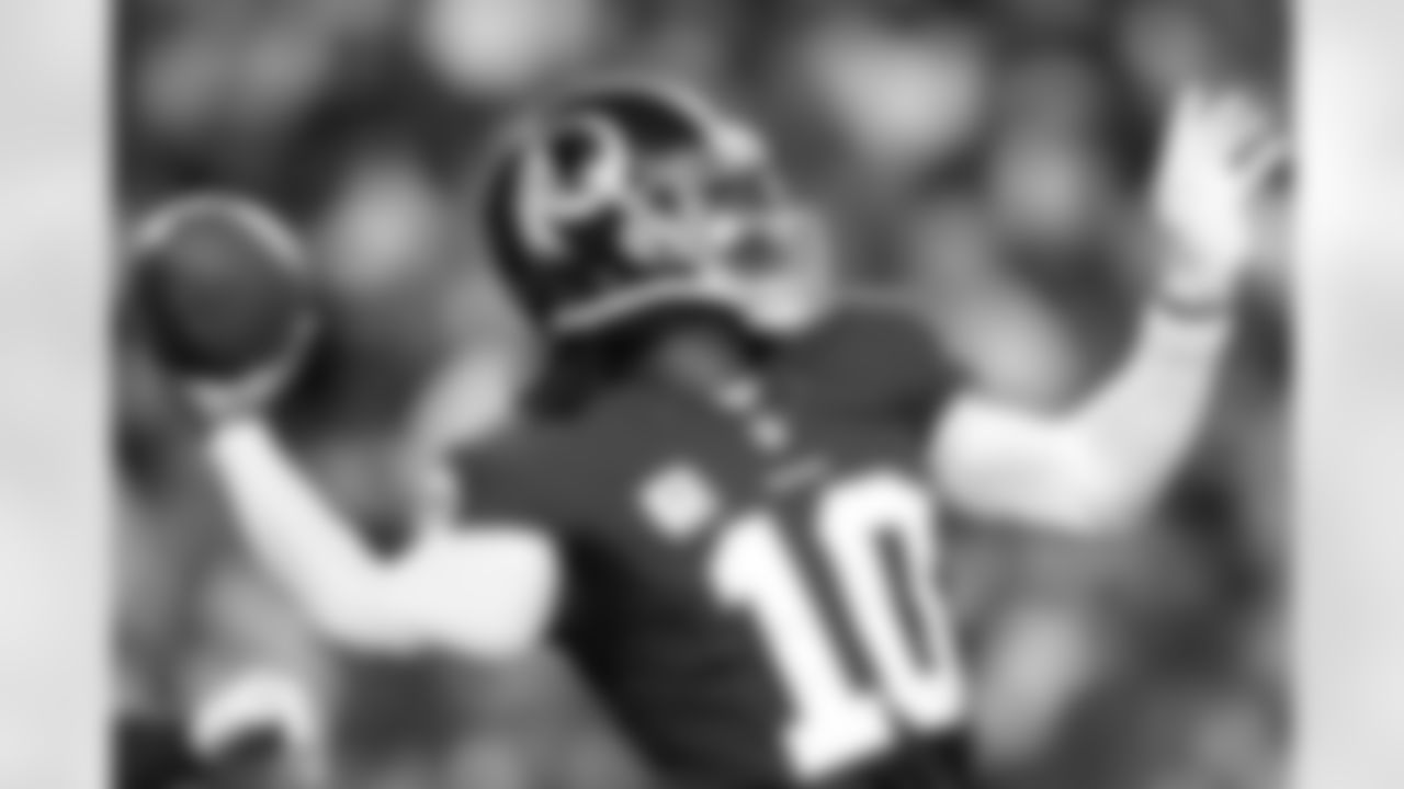 Robert Griffin III looks to complete a deep pass vs. the 49ers, at halftime the Redskins trail the 49ers 10-6.