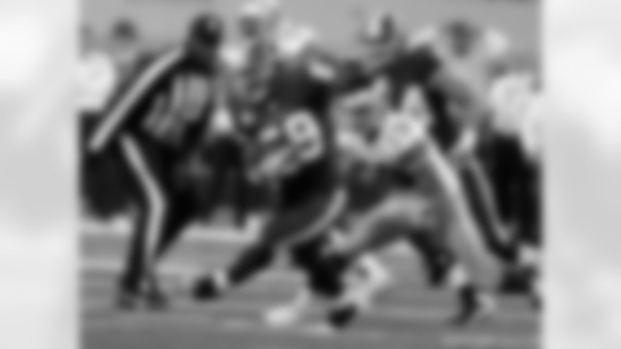 Washington Redskins linebacker London Fletcher picks off a pass intended for a Cowboys receiver.