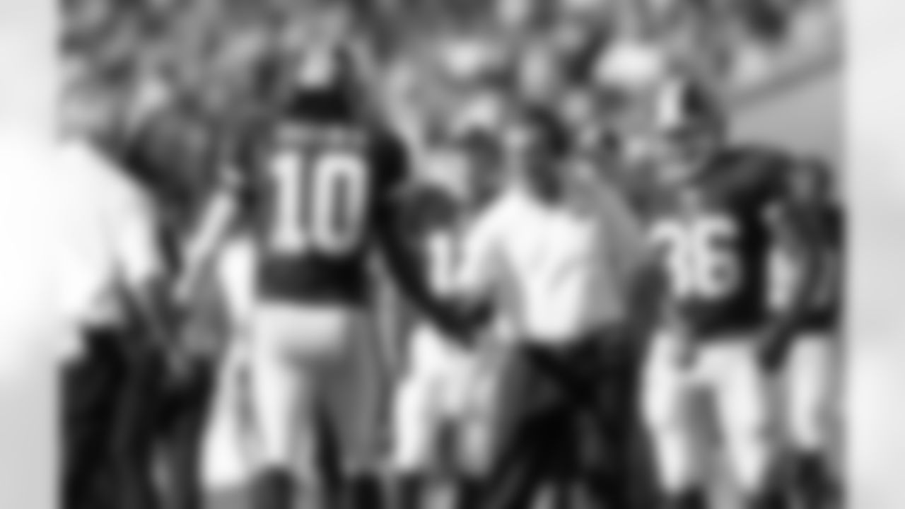 No. 11: Coach And Quarterback. Redskins' HC Mike Shanahan congratulates QB Robert Griffin III on a successful first half TD drive.
