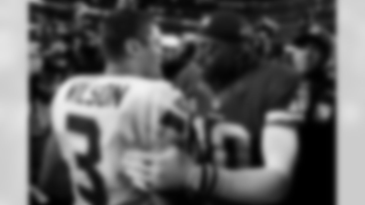 Redskins QB Robert Griffin III greets Seahawks QB Russell Wilson after the game.