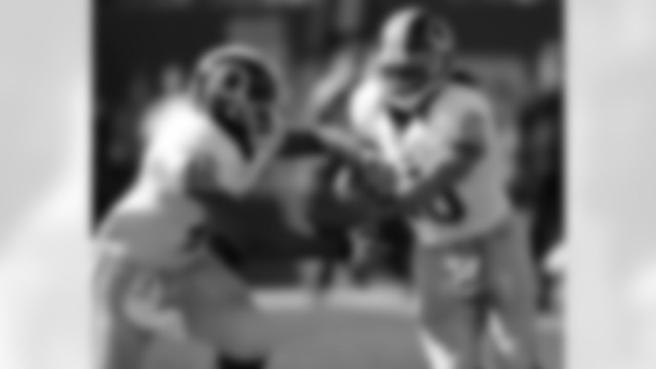 No. 8: Quarterback Robert Griffin III handing off the ball to running back Alfred Morris in Week 7. Morris would record 120 rushing yards on 22 carries that day.
