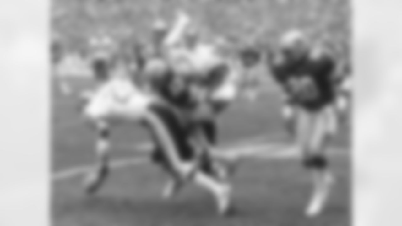 FILE - In this Jan. 22, 1983, file photo, Dallas Cowboys running back Tony Dorsett (33) takes a hard hit and fumbles the ball during first quarter of an NFL football game against the Washington Redskins in Washington. Senior U.S. District Judge Anita Brody in Philadelphia, announced Thursday, Aug. 29, 2013, that the NFL and more than 4,500 former players want to settle concussion-related lawsuits for $765 million. The plaintiffs include at least 10 members of the Pro Football Hall of Fame, including Dorsett. The global settlement would fund medical exams, concussion-related compensation and medical research. (AP Photo/File)