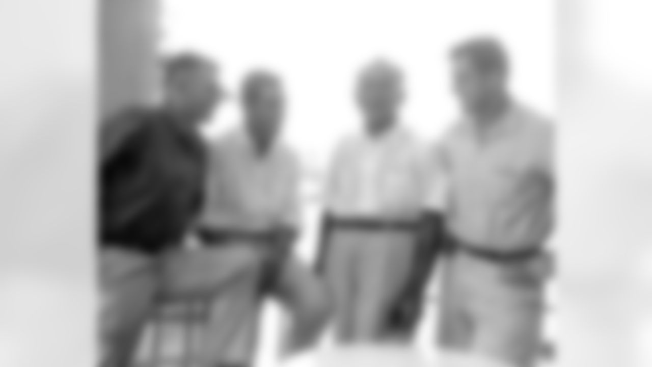 Eddie LeBaron (far left) with teammates. LeBaron was drafted in the 10th round (123rd overall) in the 1950 NFL Draft by the Washington Redskins.