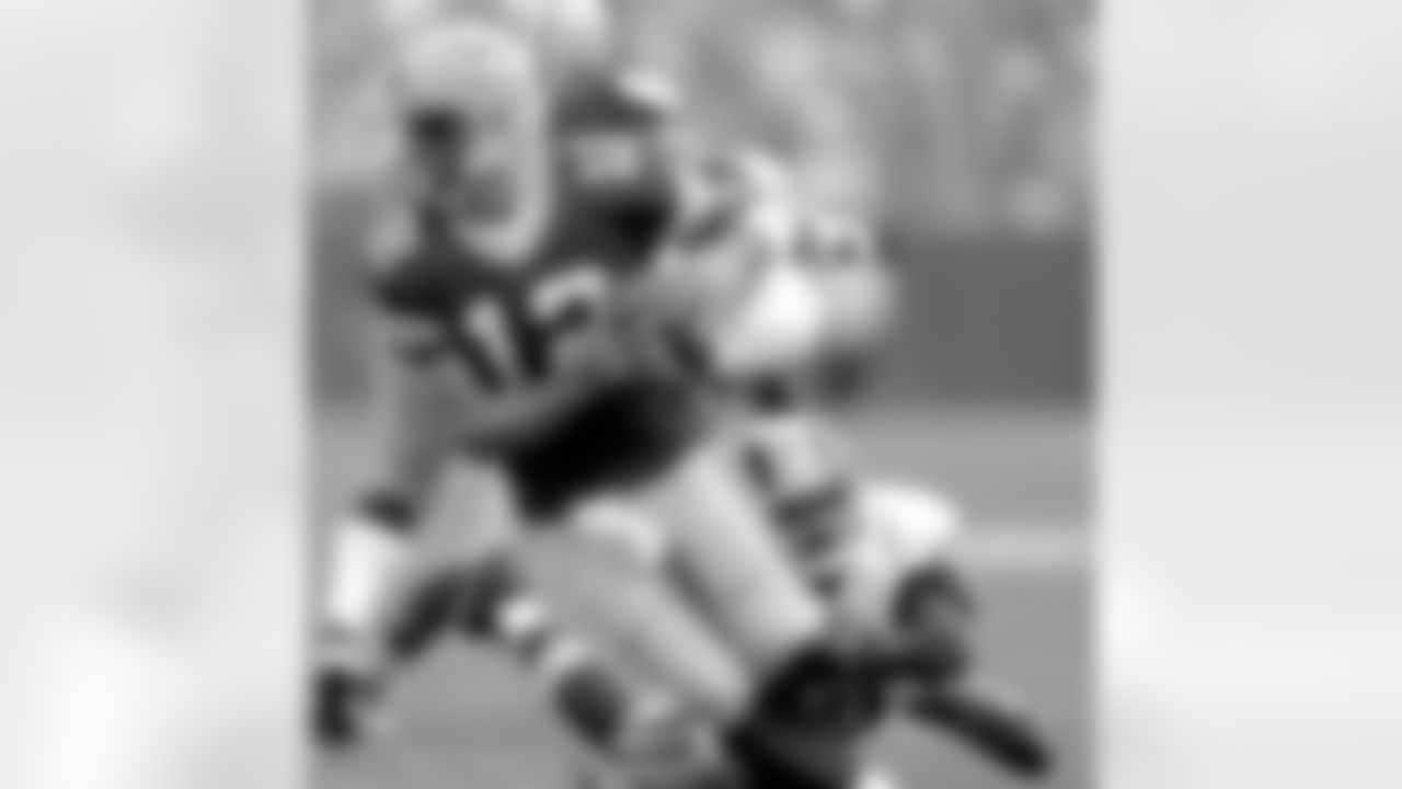 Redskins cornerback Josh Wilson sacks quarterback Aaron Rodgers on Sunday, Sept. 15, 2013, in Green Bay, Wis.