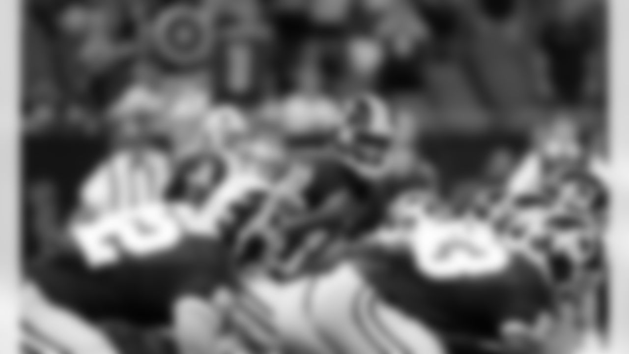Redskins' rookie QB Robert Griffin III makes a call at the line of scrimmage.