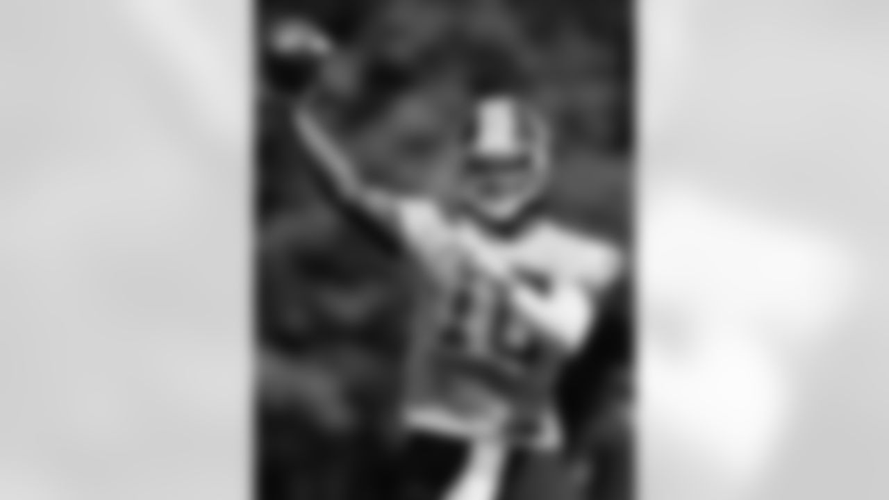 Redskins QB Robert Griffin III throws a pass during Redskins training camp practice.