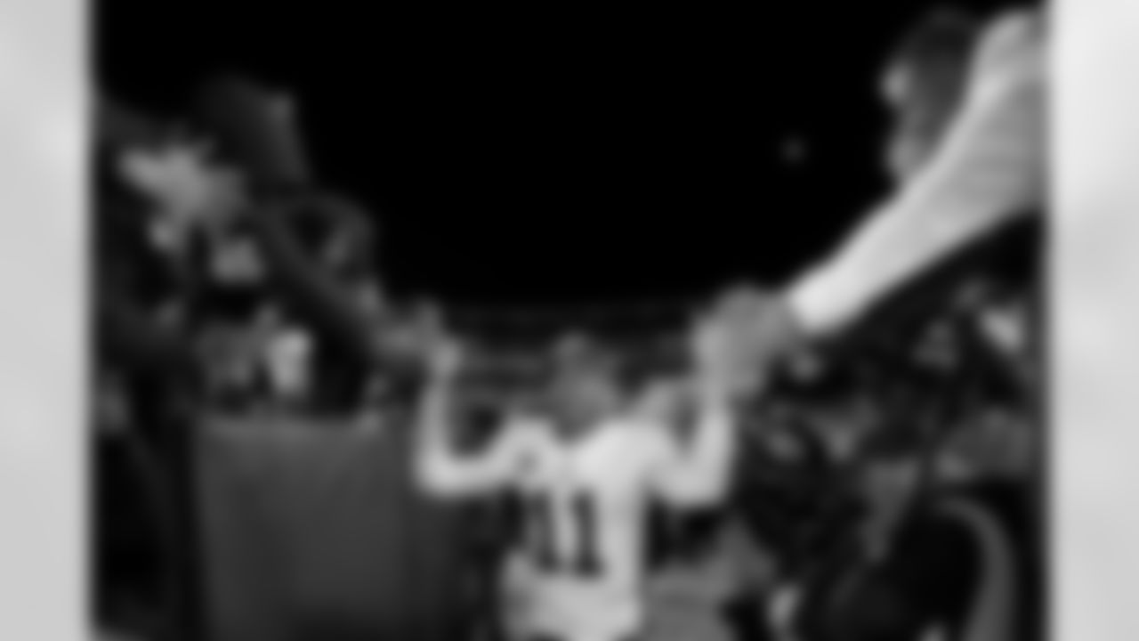 Washington quarterback Alex Smith (11) celebrates with fans after an NFL football game against the Dallas Cowboys in Landover, Md., in this Sunday, Oct. 21, 2018, file photo. Smith earned AP Comeback Player of the Year honors for getting back on the field last season, two years removed from his gruesome injury that required 17 surgeries to repair. Alex Smith is retiring from the NFL after making an improbable comeback from a broken leg. Smith announced his retirement Monday, April 19, 2021, on Instagram, saying he still has plenty of snaps left him just shy of his 37th birthday but is calling it quits to enjoy time with his family.(AP Photo/Alex Brandon, File)