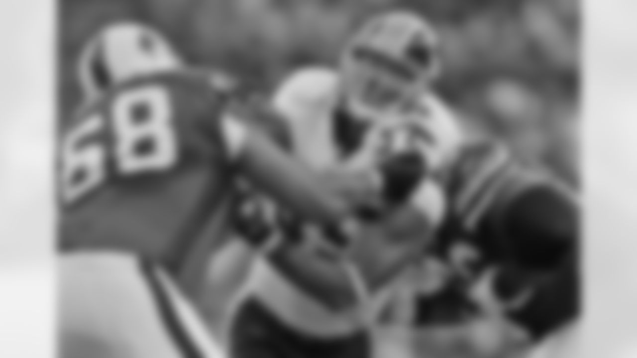 Jason Taylor, in his first action as a Redskin, gets double-teamed.