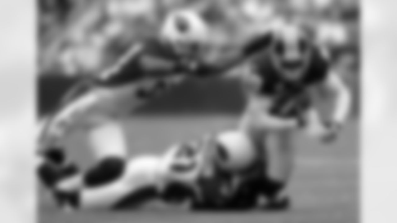 Santana Moss dives forward for extra yards in the first half.