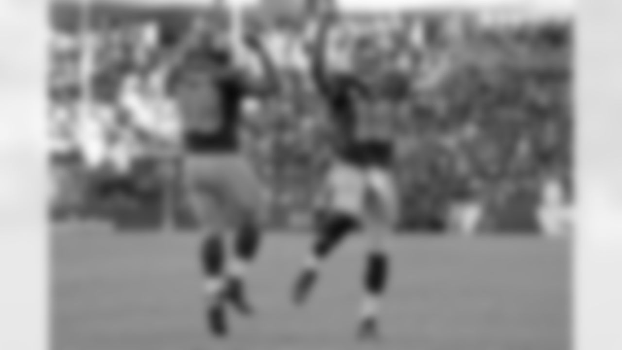 Quarterback Robert Griffin III and fullback Darrel Young celebrate Young's 1-yard touchdown run to tie the game 14-14.
