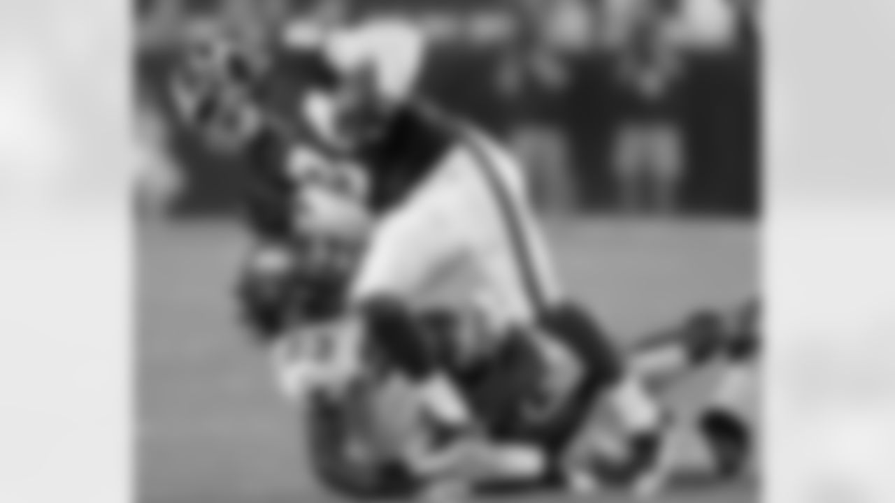 Wide Receiver Niles Paul tries to break a tackle