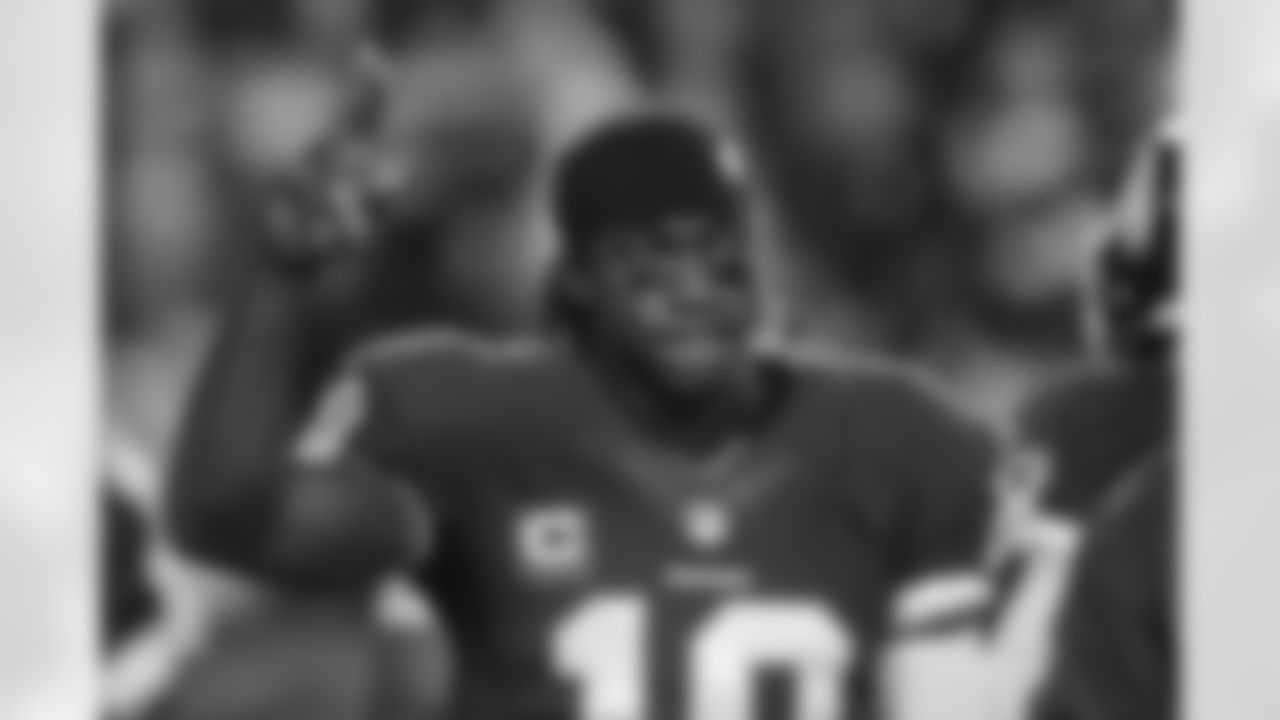Redskins QB Robert Griffin III thanks the fans as he walks off the field.