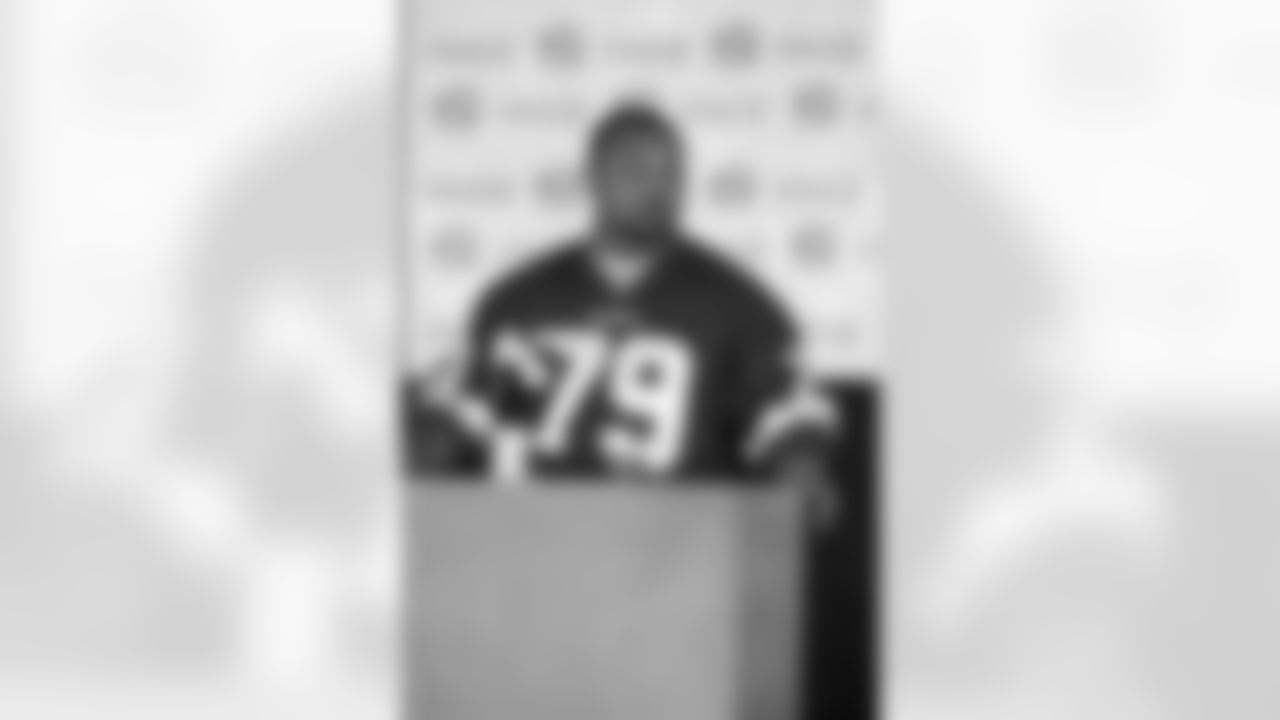 Defensive Tackle Lorenzo Alexander emcees the event and also serves as a panel guest.