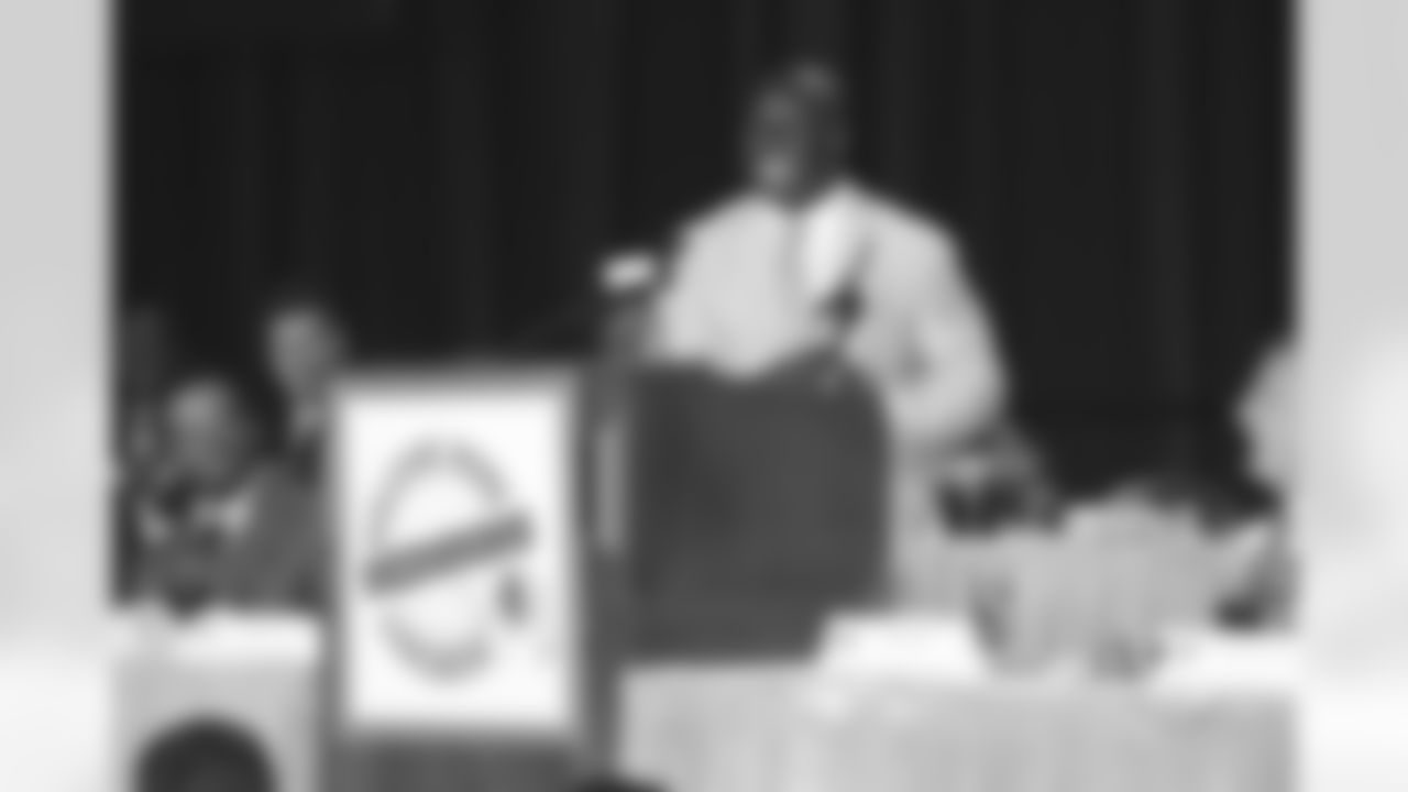 London Fletcher accepts the community award, the first given at the Welcome Home Luncheon.
