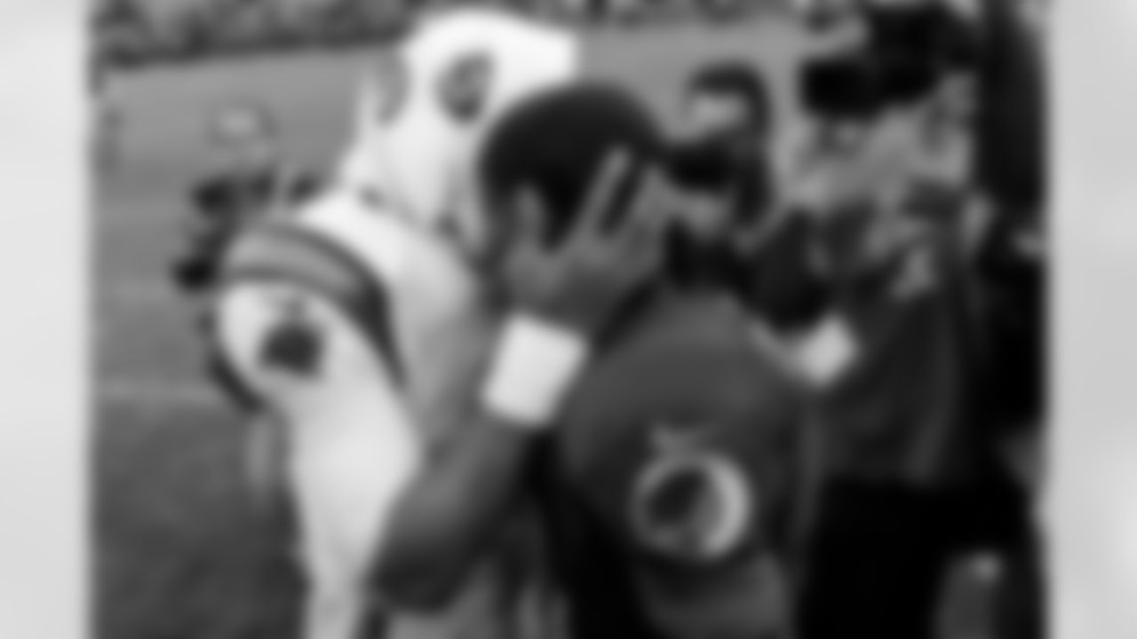 Redskins QB Robert Griffin III greets Panthers QB Cam Newton after the game.