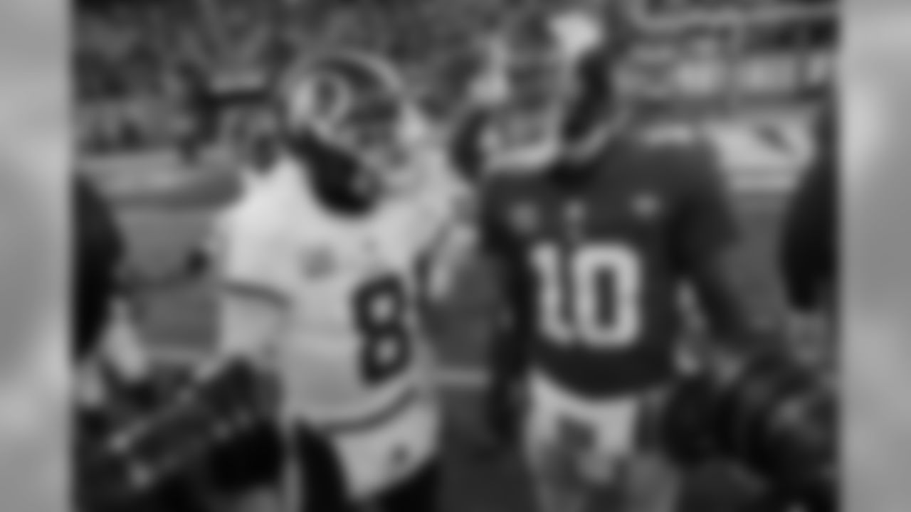 Washington Redskins quarterback Kirk Cousins (8) greets New York Giants quarterback Eli Manning (10) after an NFL football game Sunday, Dec. 31, 2017, in East Rutherford, N.J. (AP Photo/Mark Lennihan)
