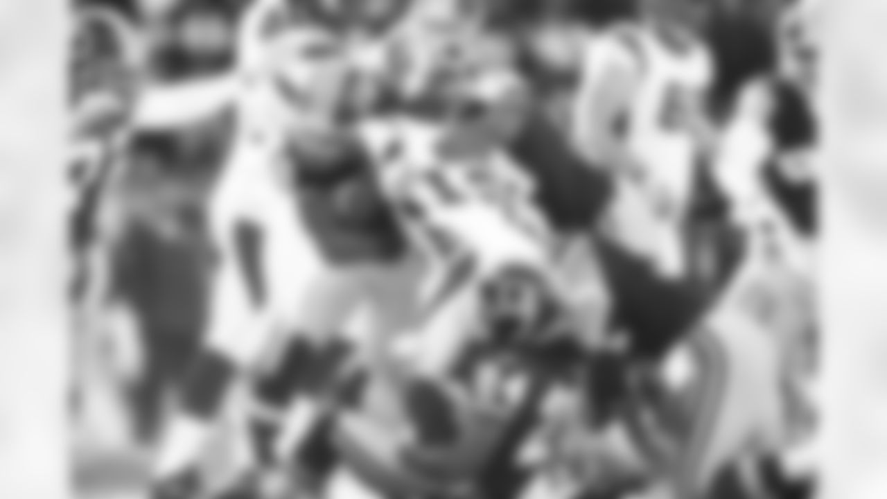 DeJon Gomes leads the charge tackling Percy Harvin.