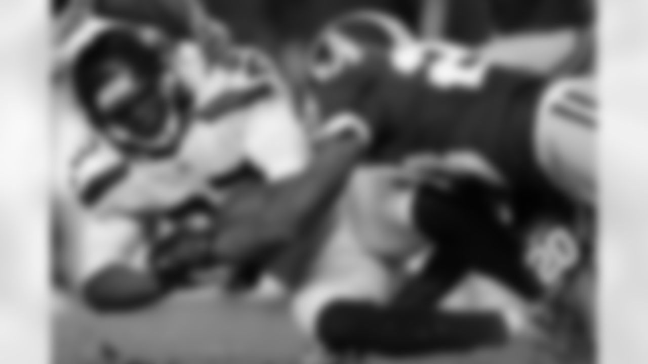 Redskins CB DeAngelo Hall puts a hard hit on a Seahawks ball carrier.