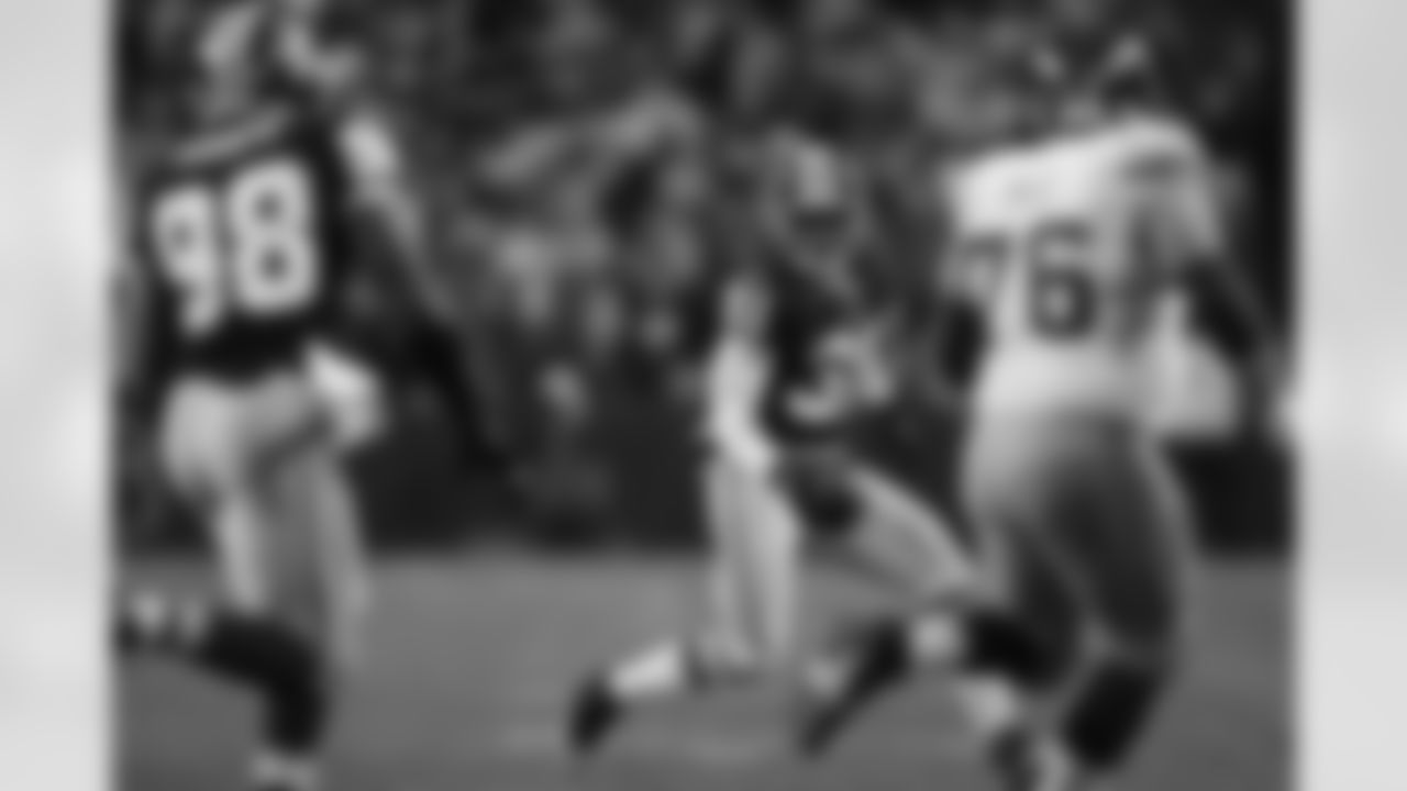 Phillip Buchanon intercepts the ball. (Ned Dishman)