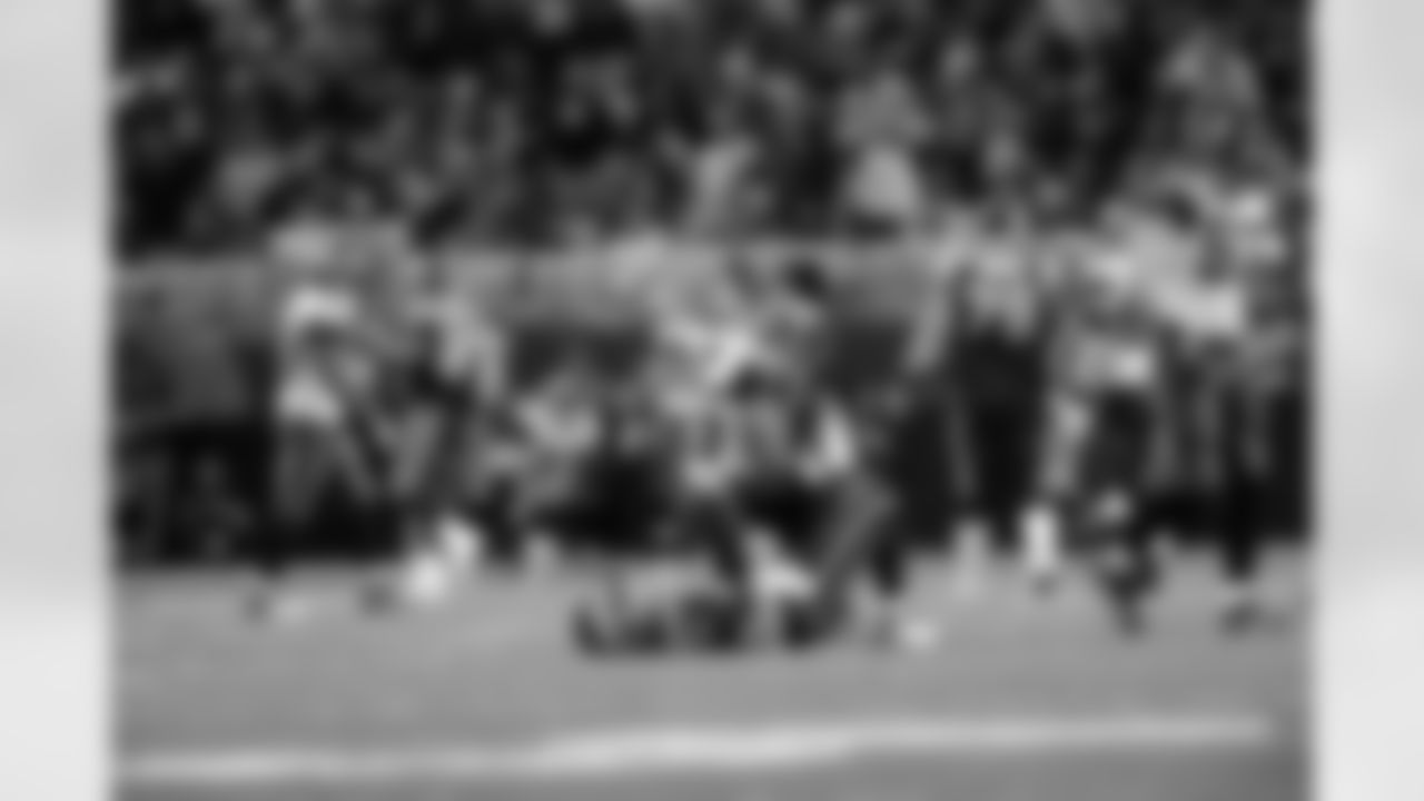 No. 3: Tapp kneeling next to St. Louis Rams quarterback Kyle Boller after his pressure forced Boller to throw one of his two interceptions in Week 13 of the 2009 regular season.