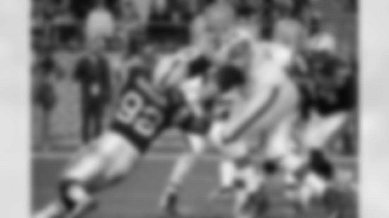 No.3: Into the ground! Tony Pashos stuffs linebacker James Harrison.