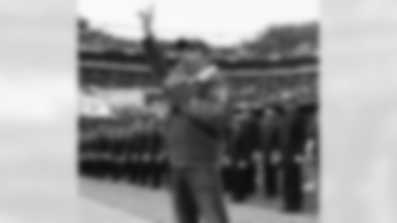 Country music singer Lee Greenwood performs at halftime.