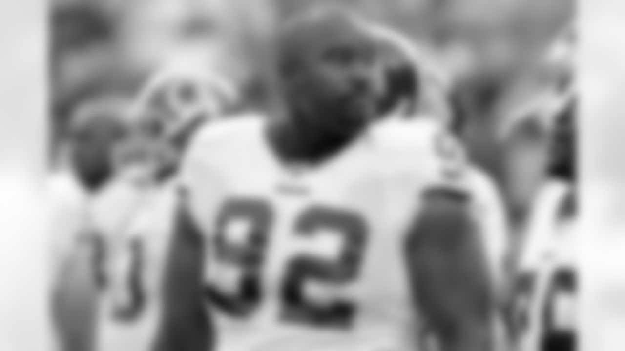 Albert Haynesworth watches the offense (AP Photo)