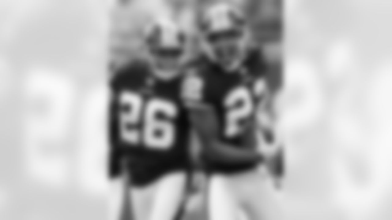 Kevin Barnes celebrates his interception with Josh Wilson.