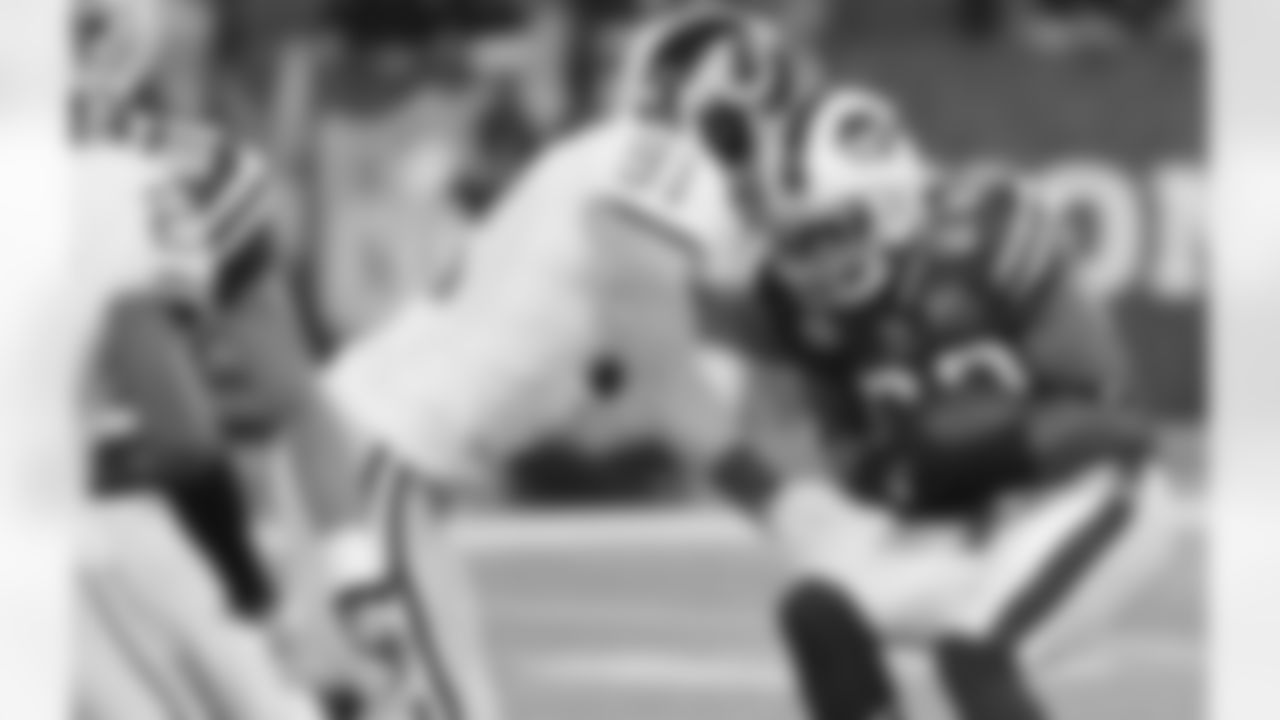 Ryan Kerrigam tries to set an early tone by tackling Bills running back Fred Jackson in the backfield.