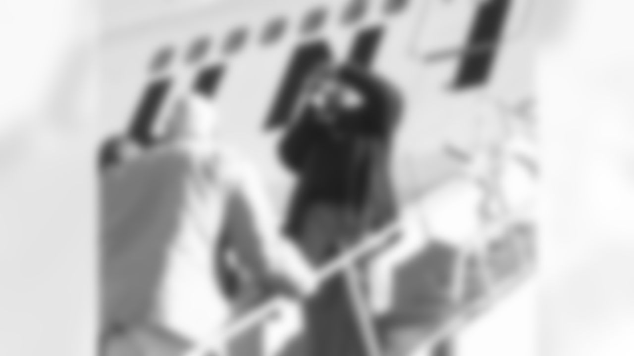 Rock Cartwright shoots some footage of players boarding the plane.