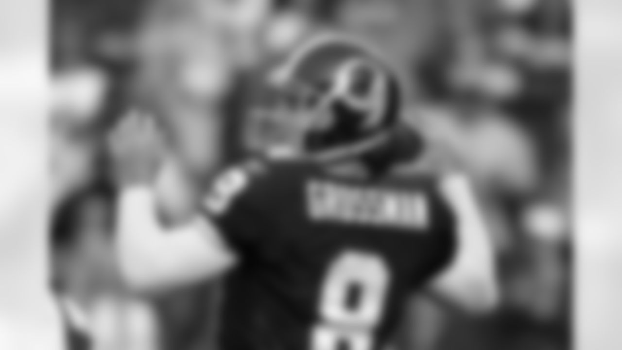 Rex Grossman warms up before the game against the Dolphins.