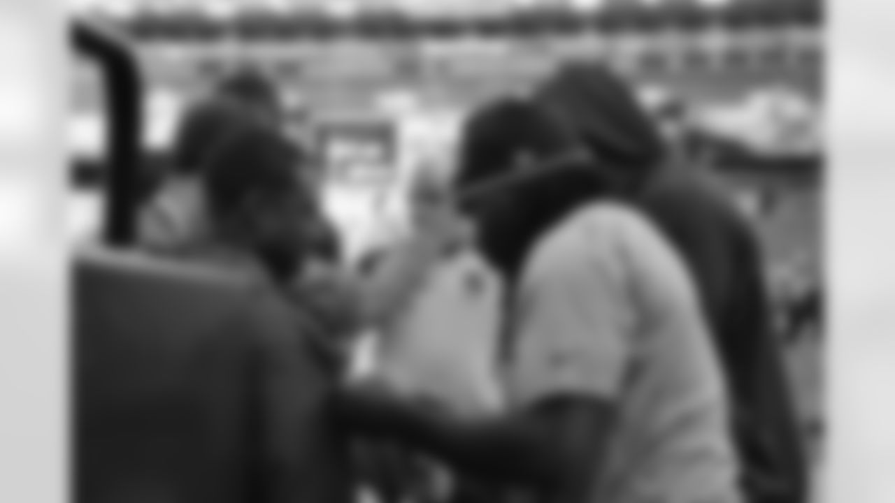 Redskins players signing autographs for fans before the game.