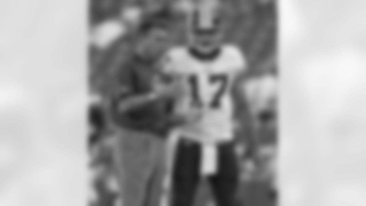 Jim Zorn talks things over with Jason Campbell.