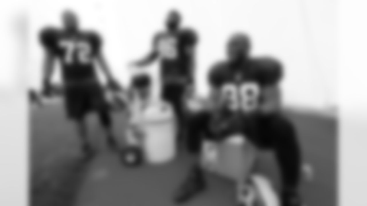 Redskins DL Stephen Bowen, DL Barry Cofield and LB Brian Orakpo chat during a water break in the Indoor Practice Facility.