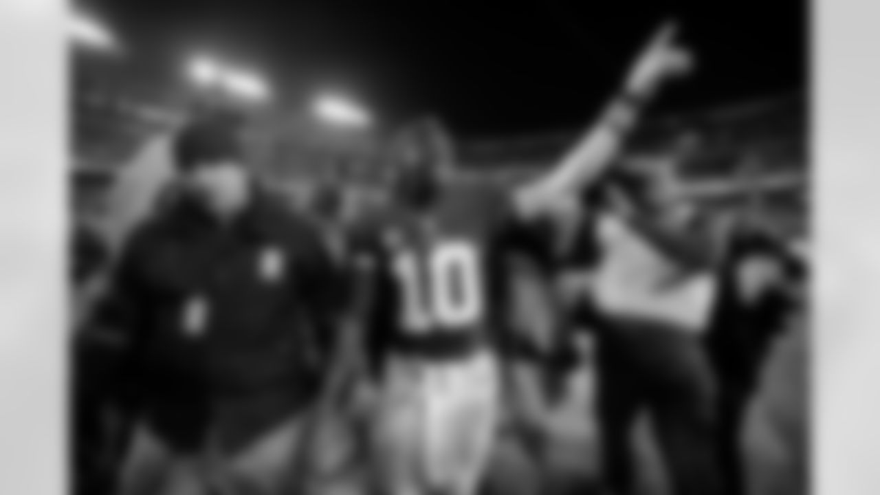 No. 1: I Do It For My City. Robert Griffin III salutes the fans after a victory in the season finale. Griffin III brought Washington its first home playoff game since 1999.