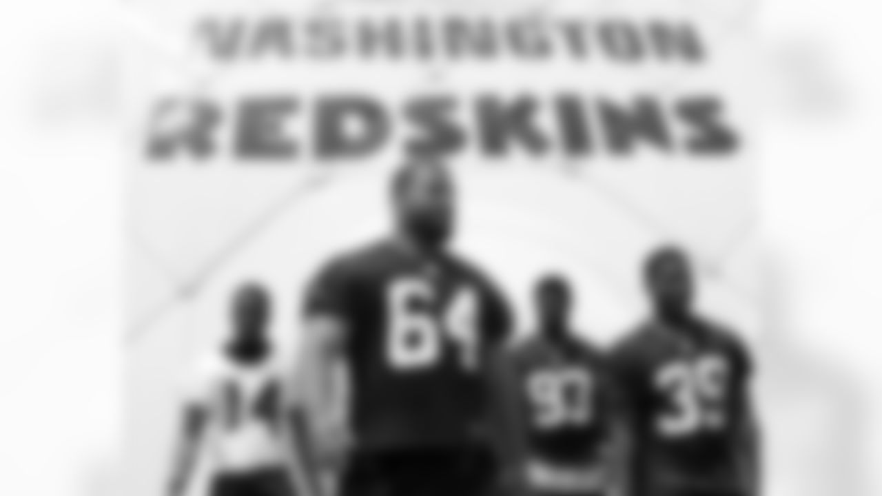 Redskins defensive line exits the indoor practice facility after walk through, led by DL Kedric Golston.
