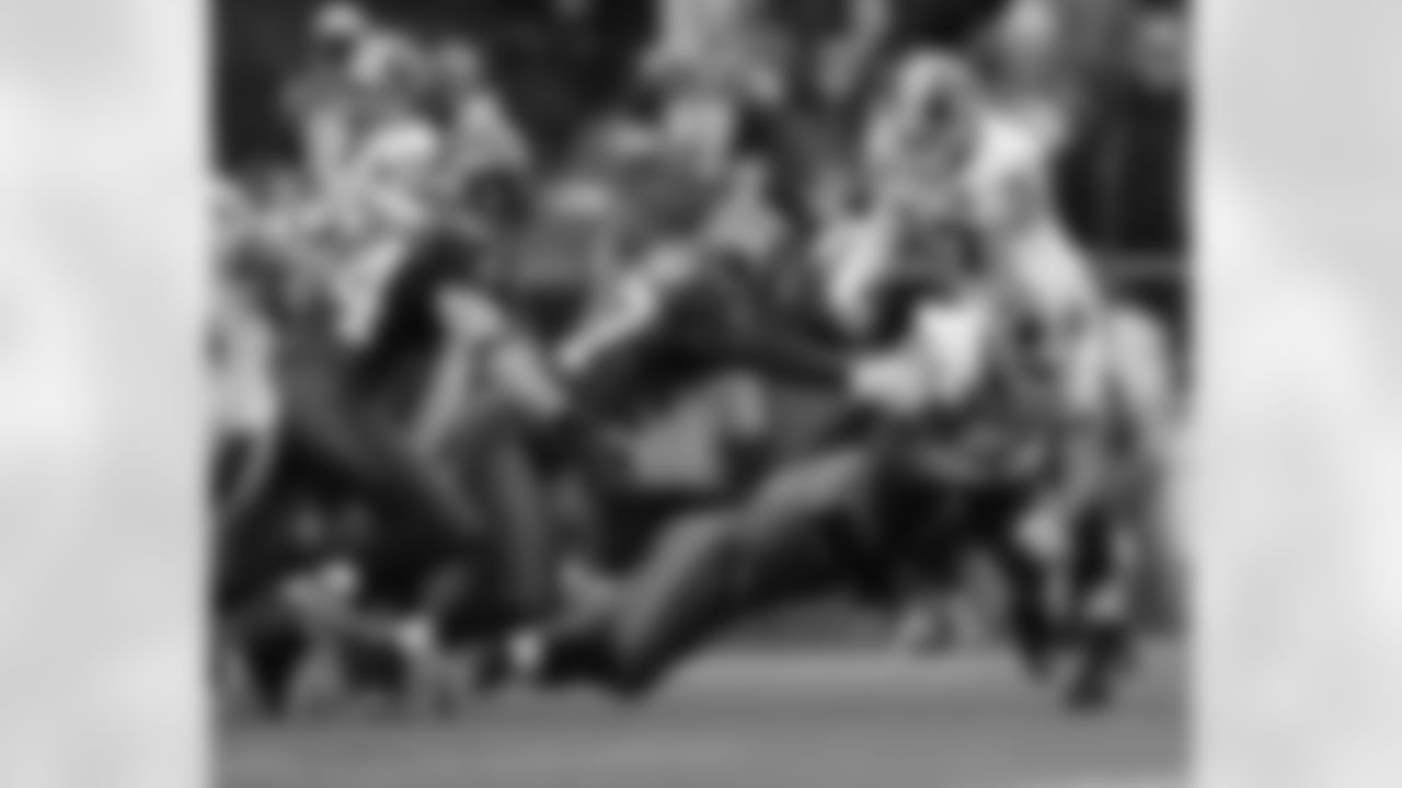 Rock Cartwright fights for yardage against Seattle's special teams.
