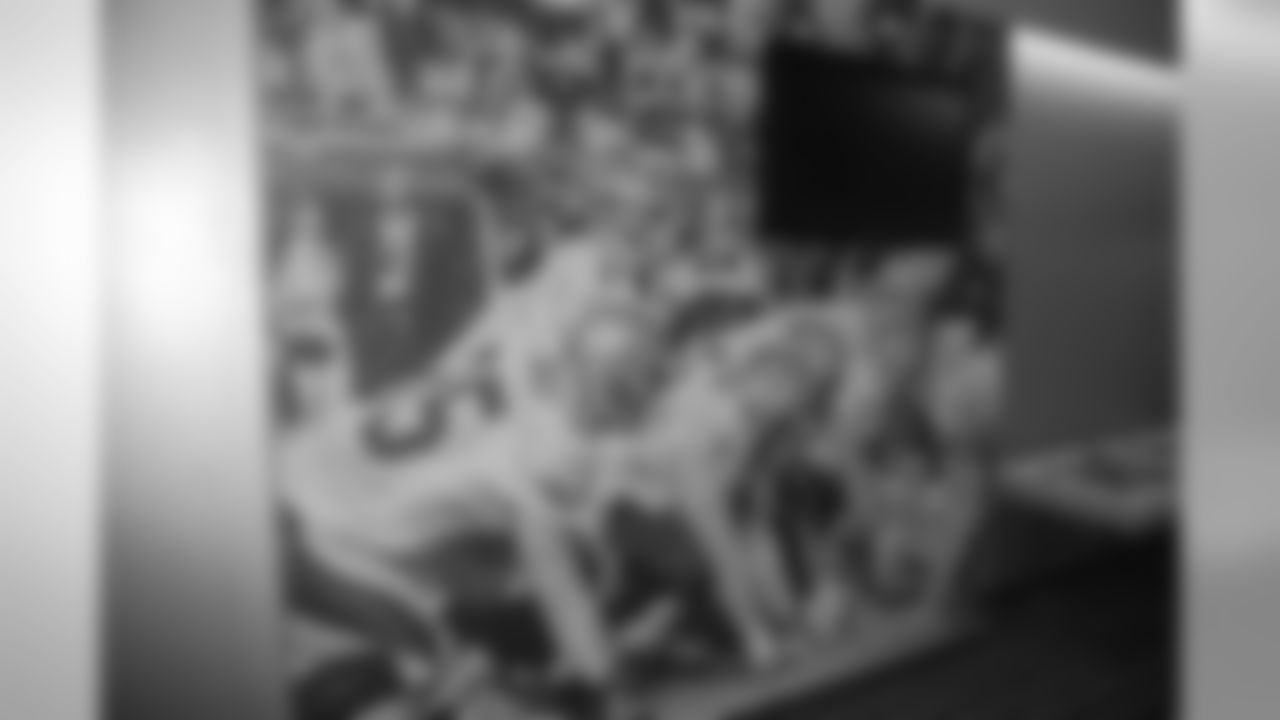 A large wall wrap inside the entrace to the Saints locker room.