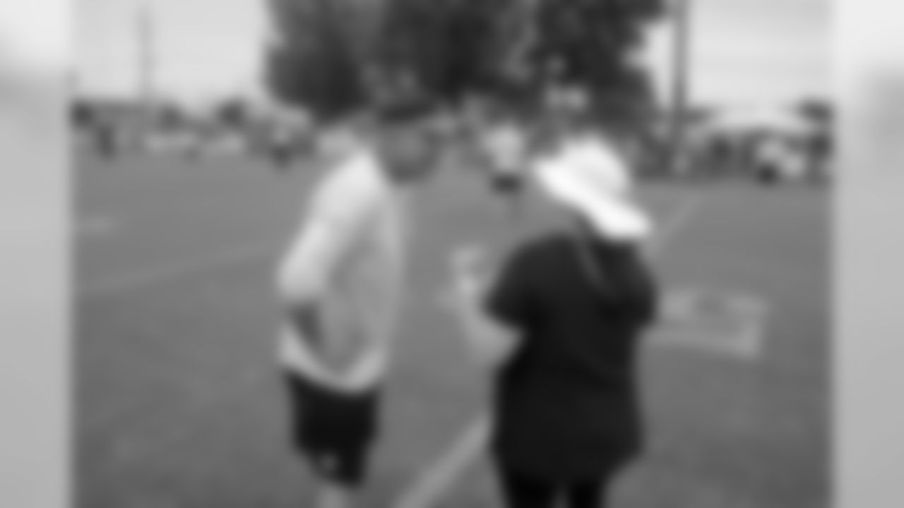 Saints head coach Sean Payton surprised two fans at Wednesday's open practice with a unique experience. Terry Gaddison Jr. and Rachel Masters joined the team on the field for a pre-challenge coin flip, group photo and autographs from the players.