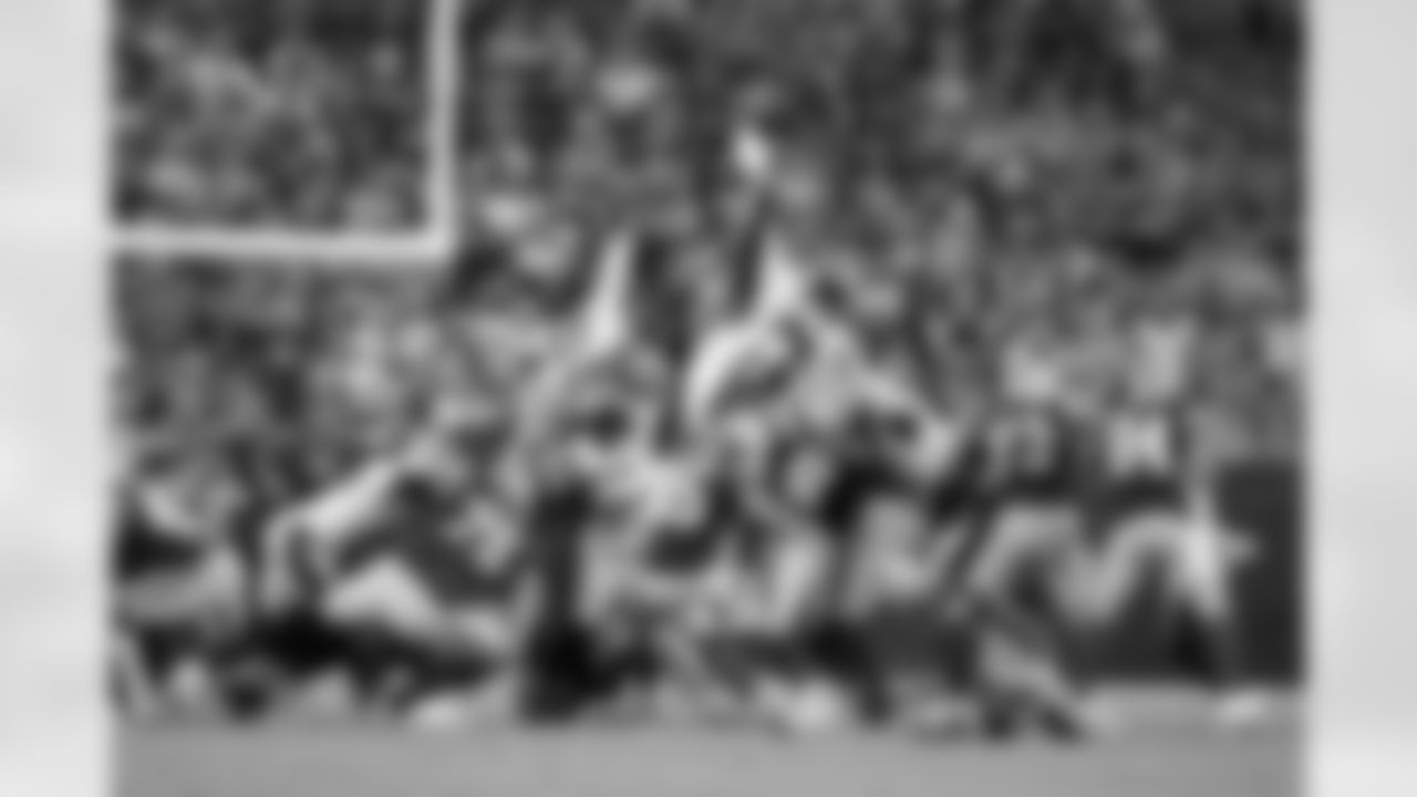 New Orleans Saints players in action during their 2022 Preseason Week 2 game against the Green Bay Packers.