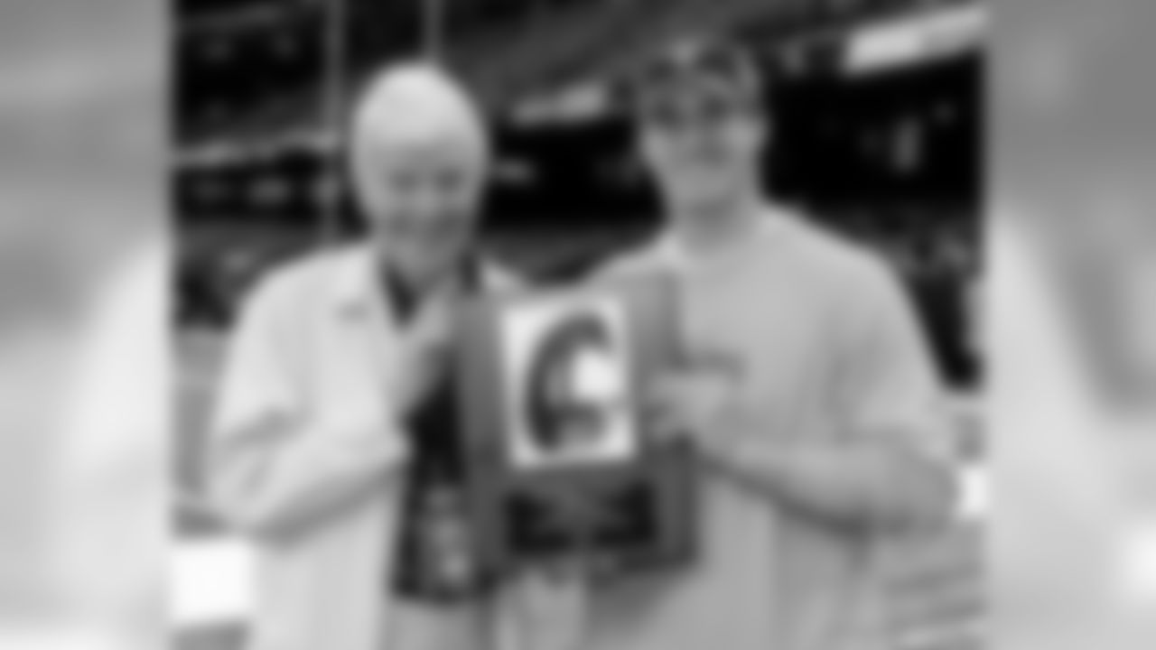 Pter Finney presents Drew Brees with the PFWA Good Guy Award